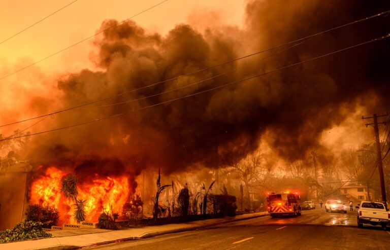 An apartment building burns during the Eaton fire in the Altadena area of Los Angeles county