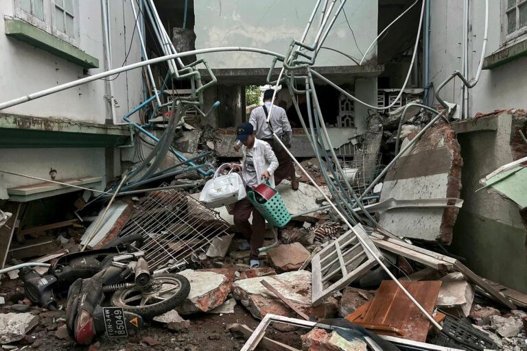 person exiting damaged building