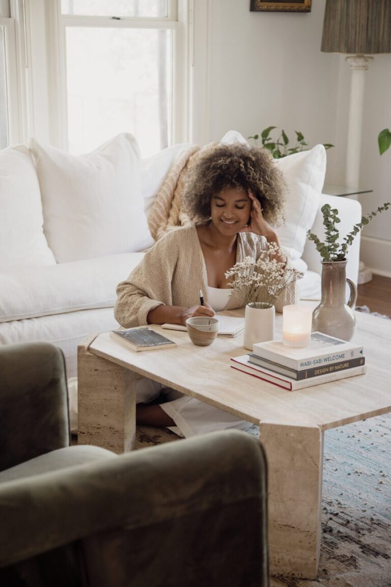 woman journaling living room 865x1298